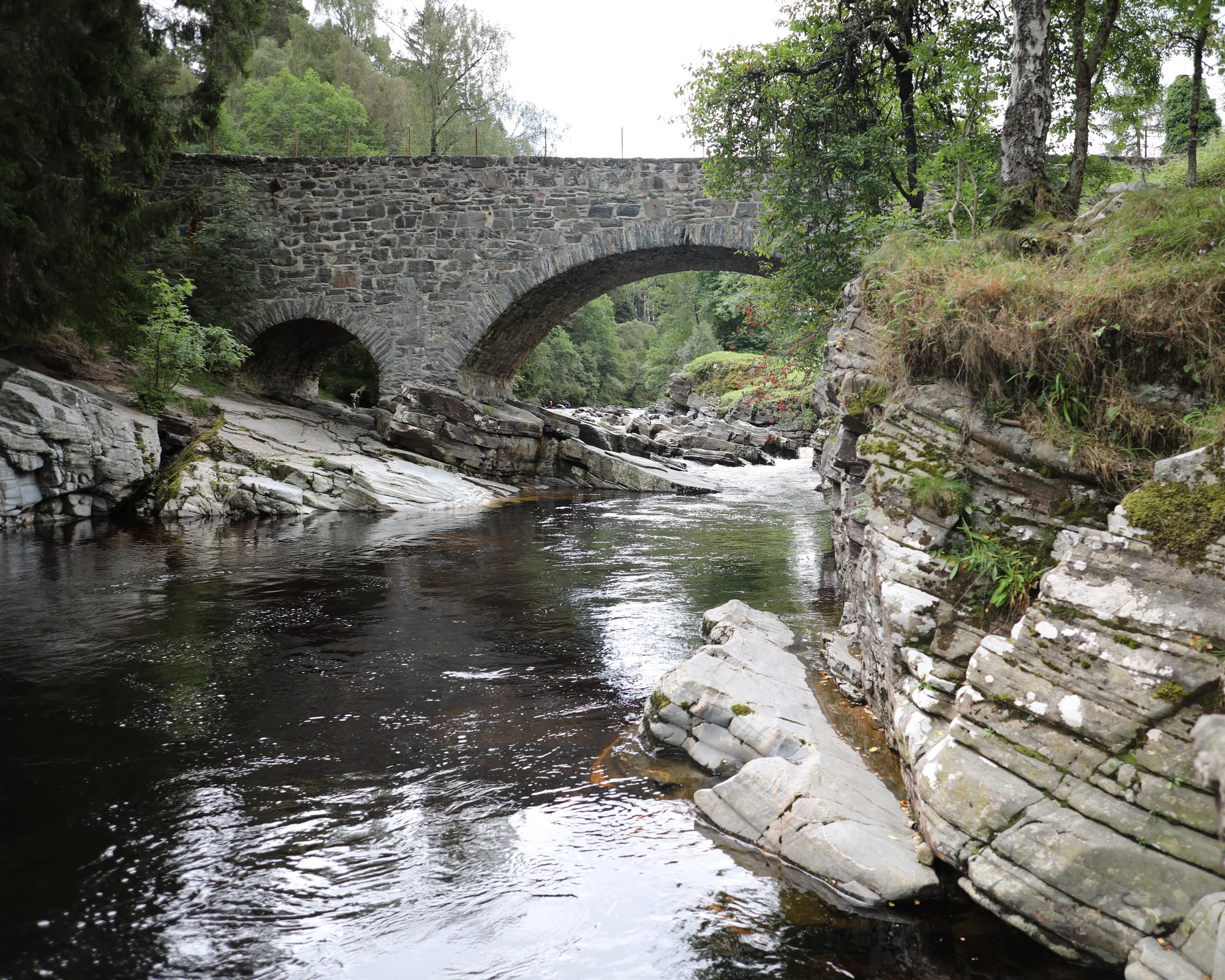 Stone bridge and river rapids at Feshiebridge